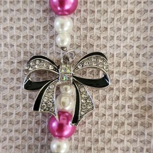 Hot pink and black beaded necklace with rhinestone bow